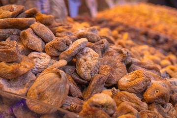 Close-up of dried figs on a counter in the bazaar. Sale of dried fruits.