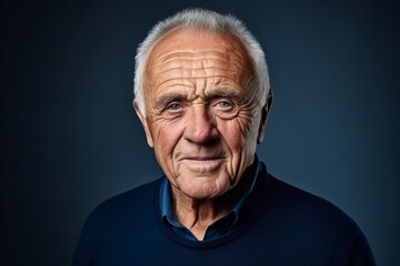 Portrait of an old man with wrinkles on his face. Studio shot.