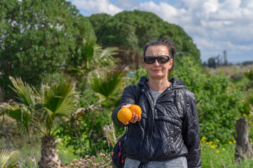 woman holding oranges in her hands 2