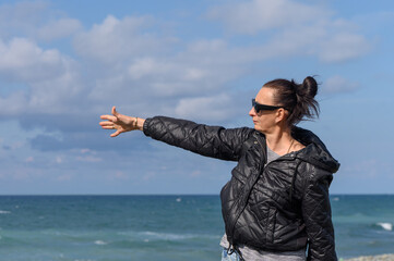 woman shows the sea on the Mediterranean coast 3