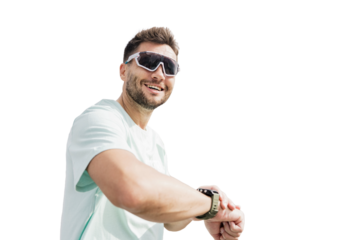 A man in sports glasses uses a fitness watch on his arm smiling warm-up workout in fitness clothes. Transparent isolated background.