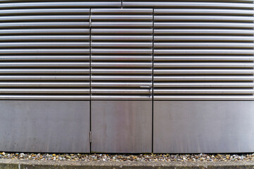 Close-up view of shiny gray metal surface of infrastructure building at Swiss university campus at Swiss City of Zürich on a sunny winter day. Photo taken February 24th, 2024, Zurich, Switzerland.