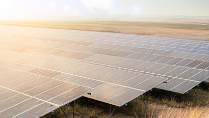 background of photovoltaic modules for renewable energy, Sunset rays over a photovoltaic power...
