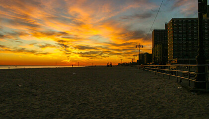 Fototapeta na wymiar Red sunset over Brighton Beach, New York, USA.