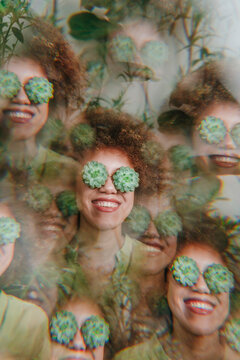 Multiple exposure of woman with echeveria flowers over eyes