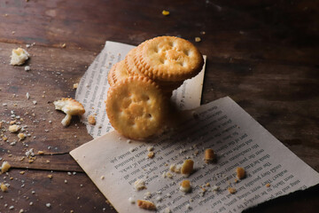 Cookies kept on a wooden table on a dark background
