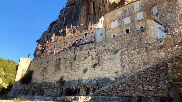 Christian Monastery built into the side of a mountain. Pustinja Blaca Monastery. Blaca Hermitage. Religion. Brac Island, Croatia. Europe.