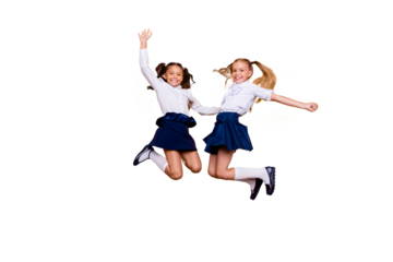 Achievements concept, dynamic images. Full length, legs, body, size portrait of carefree, careless, small girls jumping isolated on yellow background raised fists up