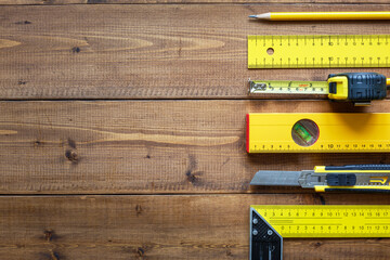 Measuring instruments on a wooden surface. Copy space. Flat lay.