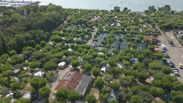 Aerial Shot of Camping Belvedere Campground and Swimming Pool at Lake Garda, Italy. Drone