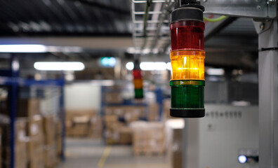 Yellow warning light inside a warehouse and distribution center