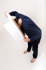 man looking into a box on a white background