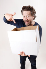 happy man pointing to the box he received