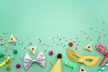 Purim celebration concept (jewish carnival holiday) over mint background