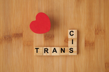 Trans pride message in crossword puzzle with a heart as sign of respect from cis community