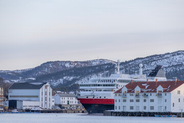 Narrow strait - The coastal ship Ms Nordlys arrives at Kristiansund harbor south...