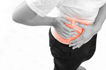 Woman suffering from waist or hip pain on white background. Chronic gastritis, office syndrome and...