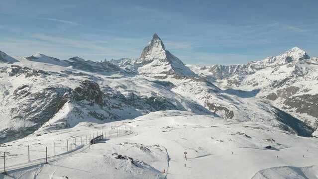 Matterhorn 4K Cinematic Aerial Footage with a train passing by - Zermatt - Switzerland