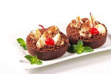 Delicious chocolate tart garnish with cherry and mint. Classic dessert. - 745728674