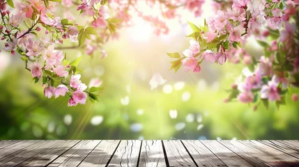 Foto op Canvas Spring sunny background with wooden tabletop and branches of blooming pink cherry. Empty space for design © Irina Sharnina