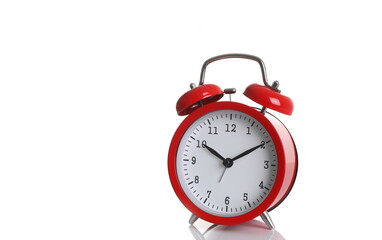 Red alarm clock isolated on white