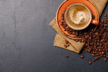 Roasted coffee beans and espresso coffee cup