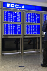 Frankfurt Airport, Germany - February 19, 2024: a departure scoreboard at the Frankfurt...