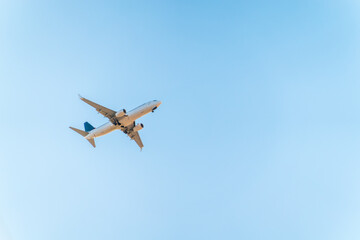 Airplane before landing in blue sky, Boeing 737-800