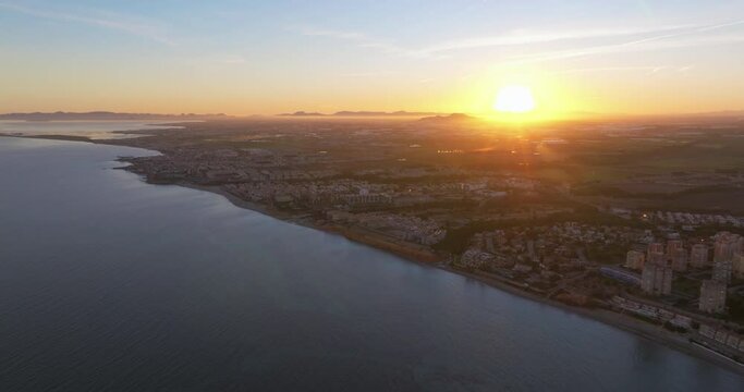 Aerial view of the beaches and coves of Torrevieja at sunset, Alicante province, Spain