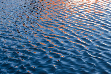 Cutout of moving water with reflections