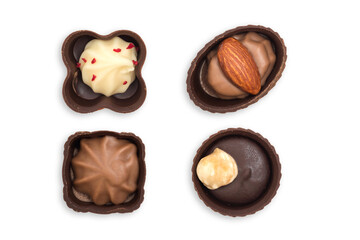 Top view of various chocolate candies isolated on white background