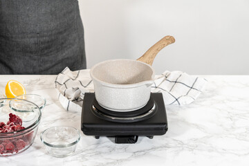 Simmering Sweetness - Raspberry Cake Filling in Saucepan