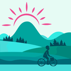 Boy riding a bike with mountains background