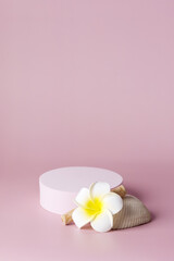 White podium with t flowers on pink background, spring tropical concept display for products cosmetics and perfumery vertical
