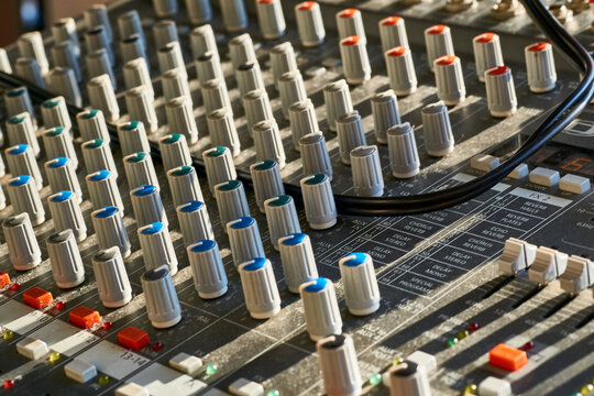 Mixing console for controlling the volume, frequencies of musical instruments