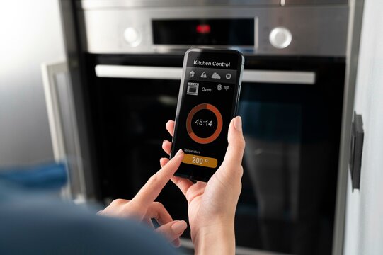 Close up smartphone with kitchen control