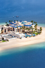 Dubai luxury villas real estate on The Palm Jumeirah artificial island with beach portrait format