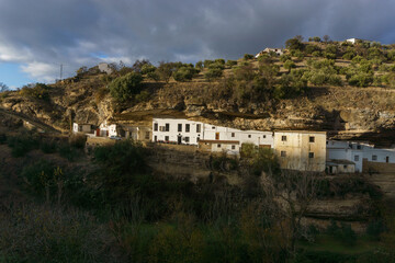 Fototapeta na wymiar White house at typical andalusian village in beautiful sunlight, Setenil de las Bodegas, Andalusia, Spain