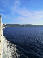 View over the adriatic sea near Split, Croatia from a ferry boat. Blue sky, deep blue sea