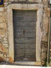 ancient door in Bol, island Brac, Croatia