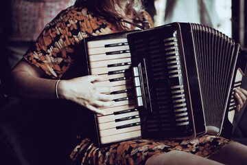 Playing the accordion. Close up.  - obrazy, fototapety, plakaty