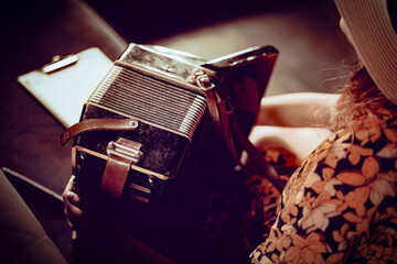 Playing the accordion. Close up. 
