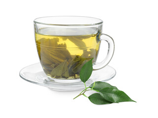 Fresh green tea in glass cup, leaves and saucer isolated on white