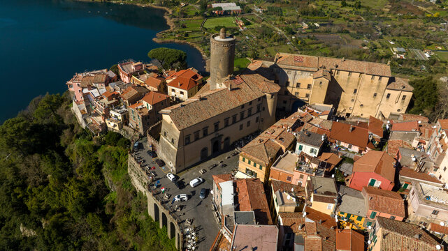 Aerial view of Nemi, a town of Castelli Romani regional park, in the Metropolitan City of Rome, Italy. The historic center is located in the Alban Hills overlooking Lake Nemi, a volcanic crater lake. 