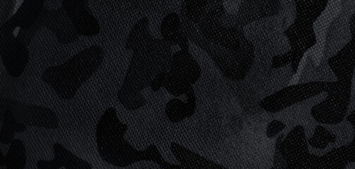 Naklejka premium Texture of camouflage fabric as background, black and white effect. Banner design