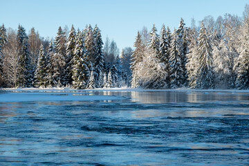River landscape with frost and snow in a cold morning. Farnebofjarden national park in north of Sweden.