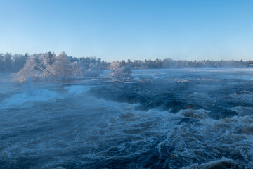 River landscape with frost and snow in a cold morning. Farnebofjarden national park in north of Sweden. - 745790282