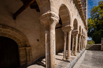 Fototapeta na wymiar arcaded gallery of semicircular arches on paired columns, Church of the Savior, 13th century rural Romanesque, Carabias, Guadalajara, Spain