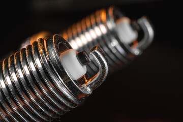 Close view. Automotive spark plugs for gasoline engines. Nickel electrode, insulator. The concept...