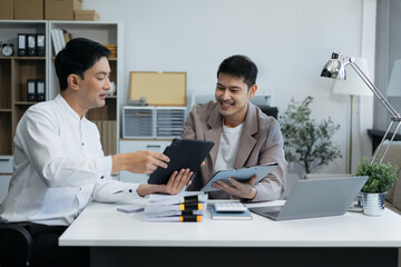 Business team present. professional investor working new start up project. Finance managers meeting.using smart phone and laptop and digital tablet computer in modern office.